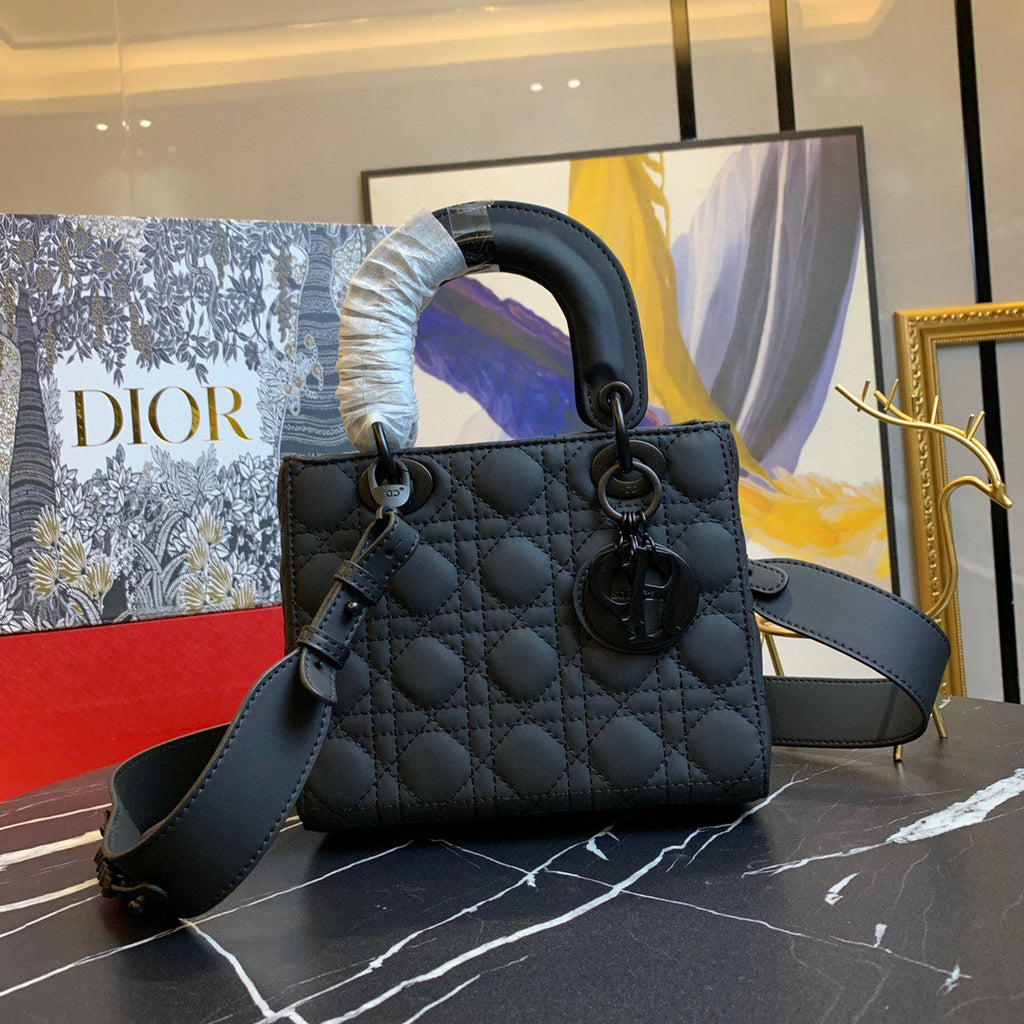 black Dior Lady Dior bag in cannage lambskin leather.