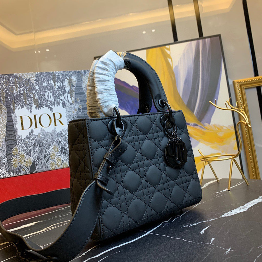 black Dior Lady Dior bag in cannage lambskin leather.