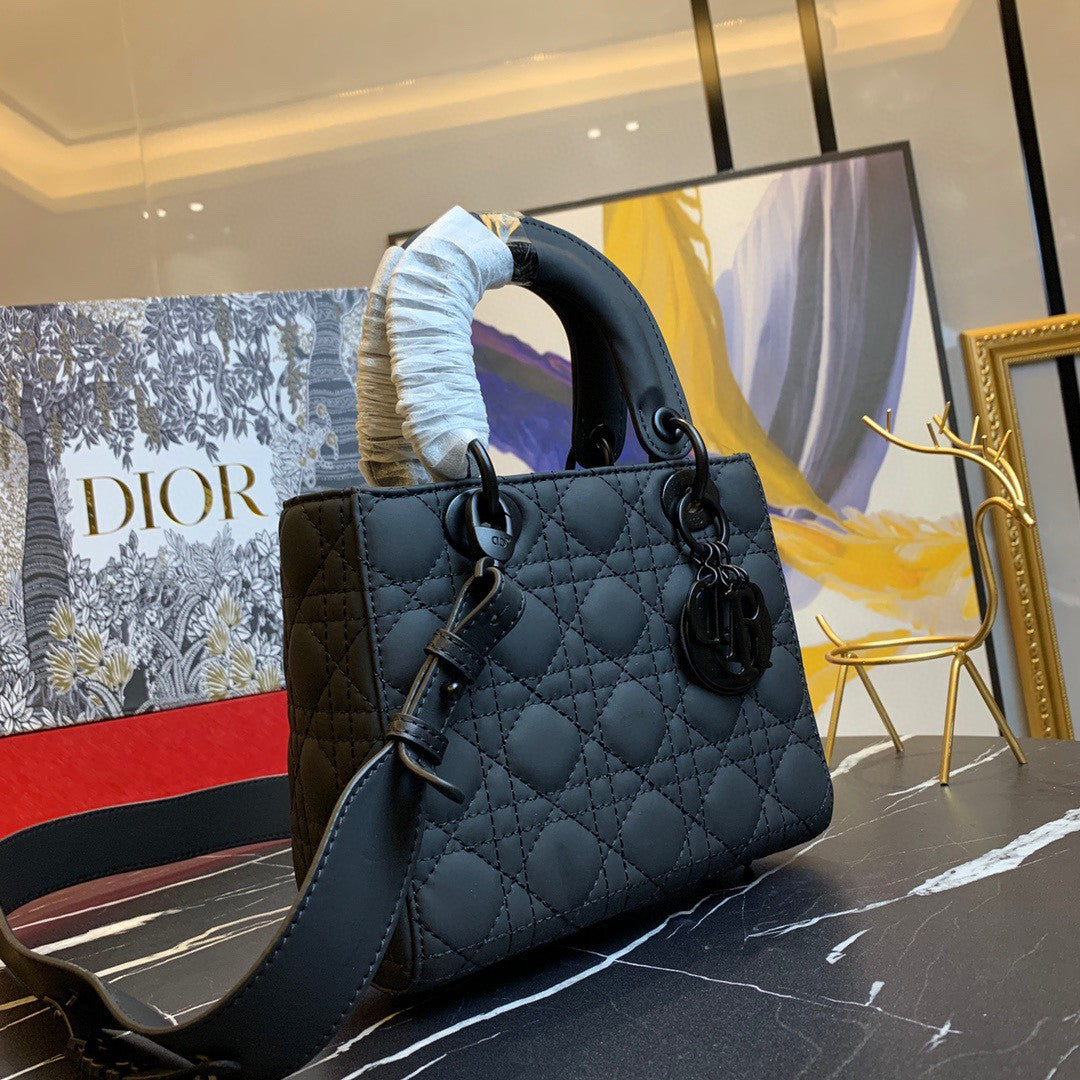 black Dior Lady Dior bag in cannage lambskin leather.