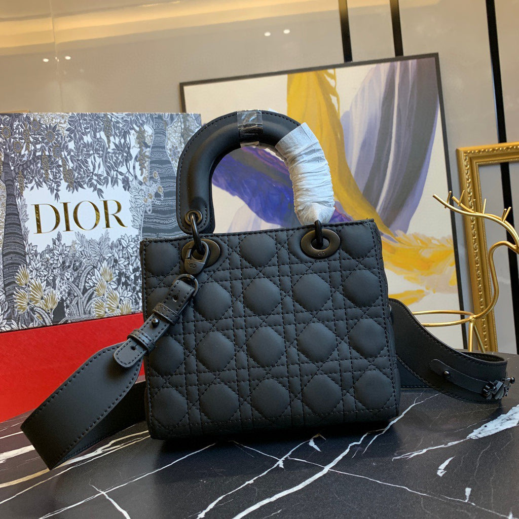 black Dior Lady Dior bag in cannage lambskin leather.