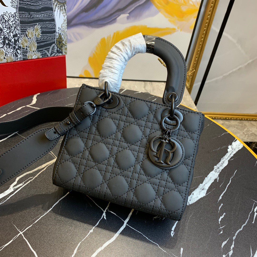 black Dior Lady Dior bag in cannage lambskin leather.