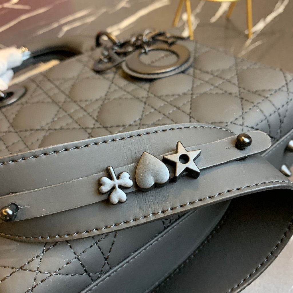 black Dior Lady Dior bag in cannage lambskin leather.