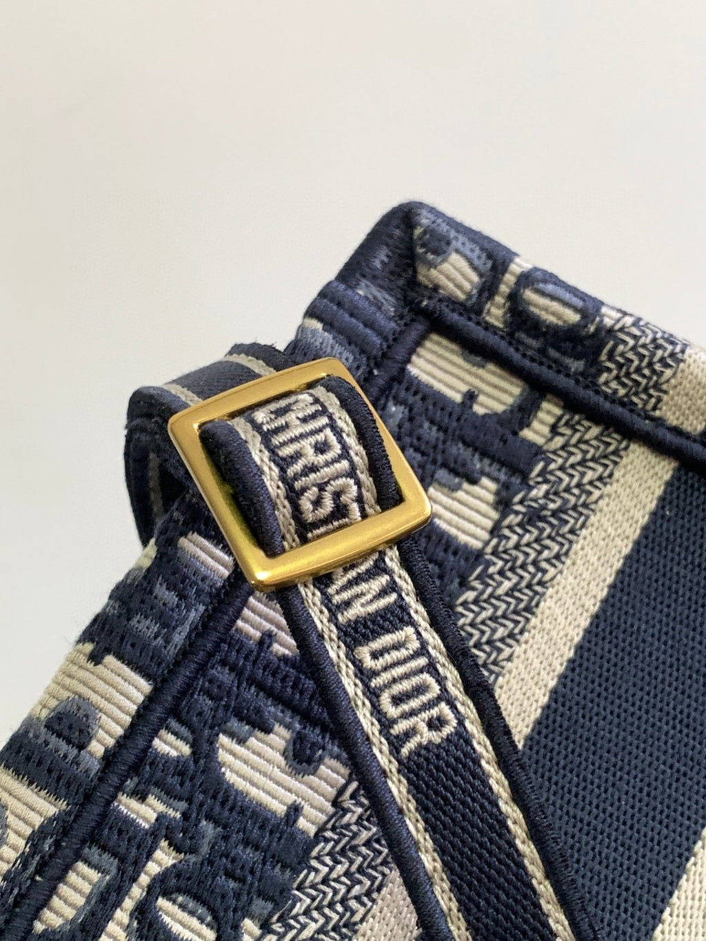 Mini or East-West Dior Book Tote with a strap, featuring blue Dior Oblique embroidery and calfskin