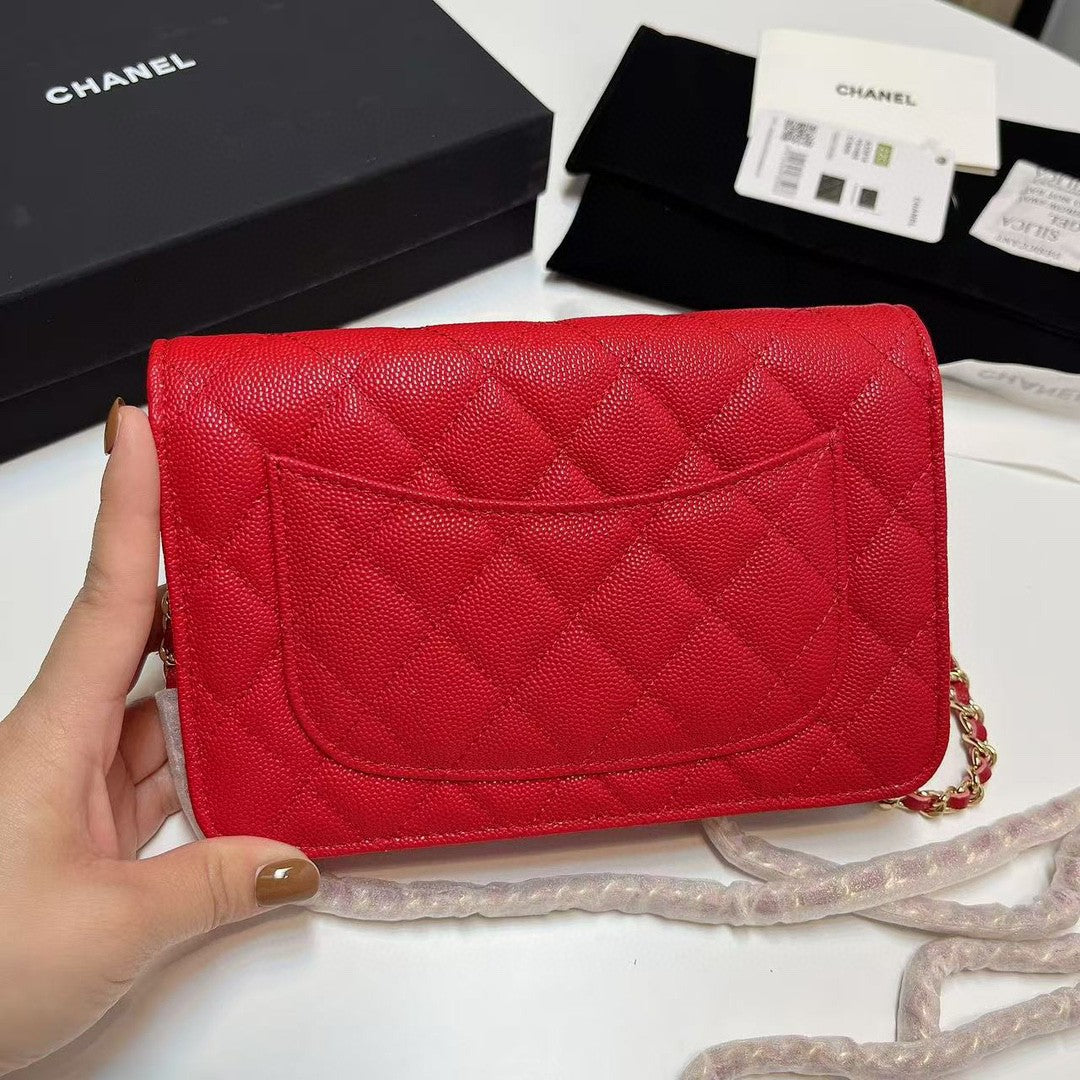 Chanel Wallet on Chain (WOC) bag in red caviar leather with gold-tone hardware
