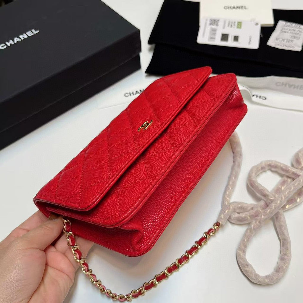 Chanel Wallet on Chain (WOC) bag in red caviar leather with gold-tone hardware