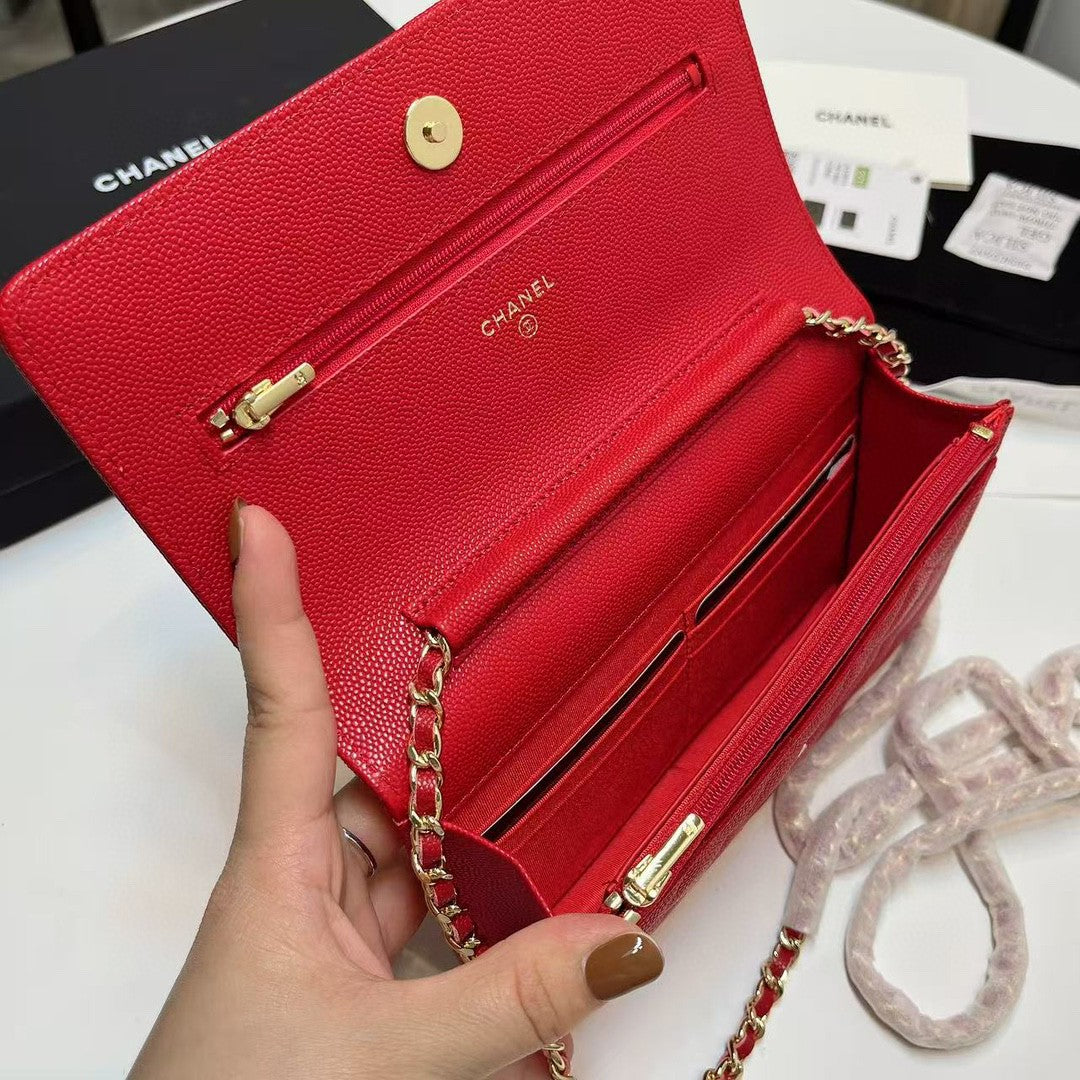 Chanel Wallet on Chain (WOC) bag in red caviar leather with gold-tone hardware