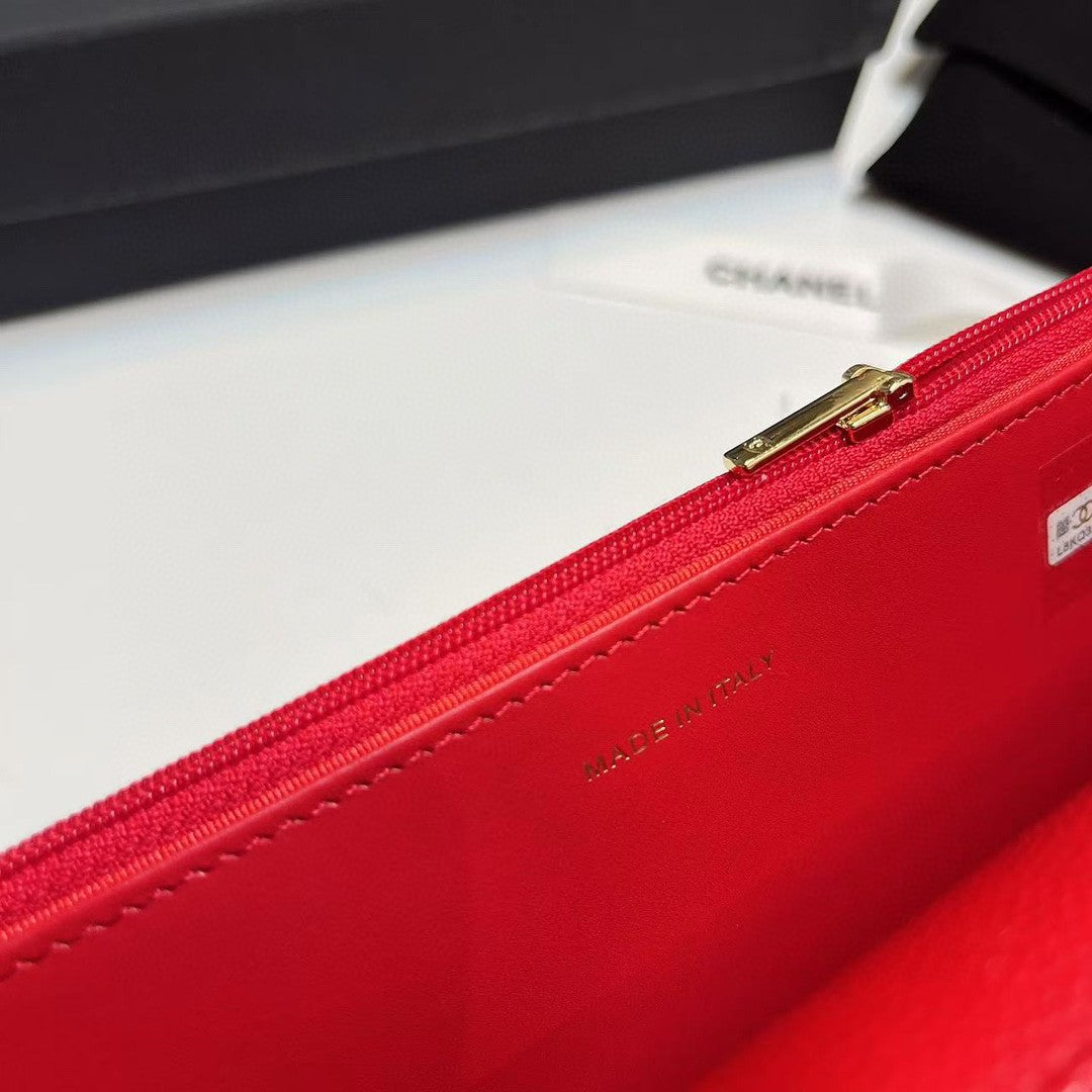 Chanel Wallet on Chain (WOC) bag in red caviar leather with gold-tone hardware