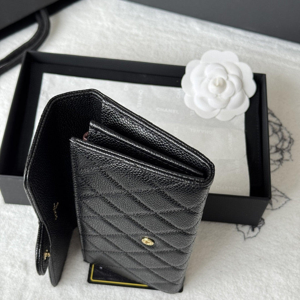 Chanel Classic Long Flap Wallet in black caviar leather with gold-tone hardware