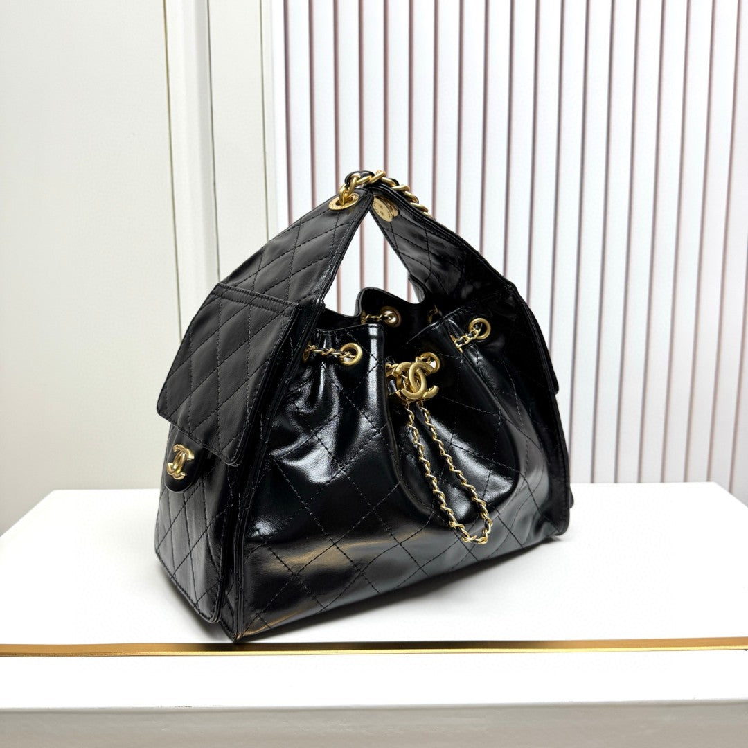 Chanel 25 small hobo bag in black shiny crumpled calfskin leather with mixed metal hardware