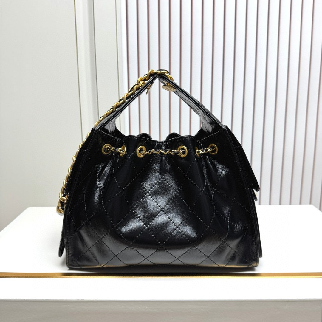 Chanel 25 small hobo bag in black shiny crumpled calfskin leather with mixed metal hardware