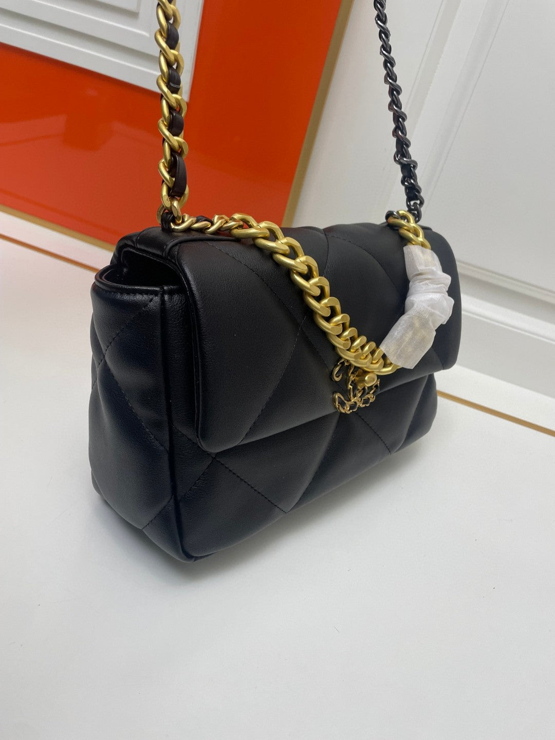black Chanel 19 flap bag in lambskin with gold-tone