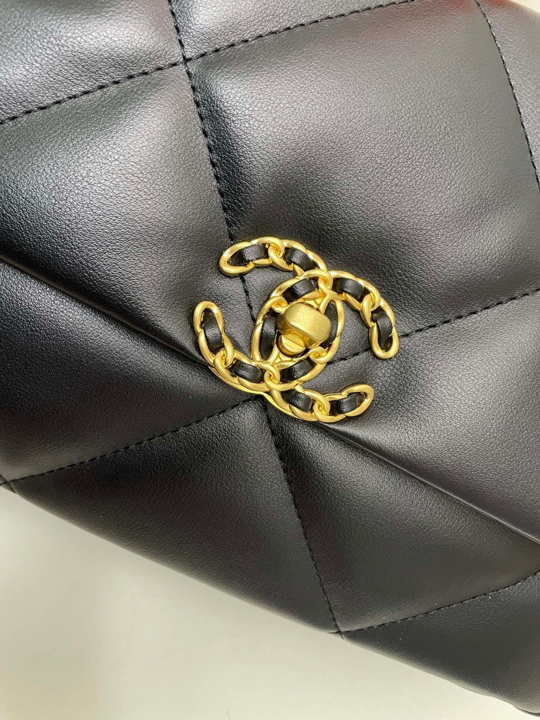 black Chanel 19 flap bag in lambskin with gold-tone