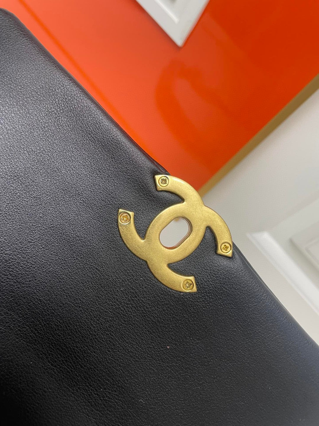 black Chanel 19 flap bag in lambskin with gold-tone