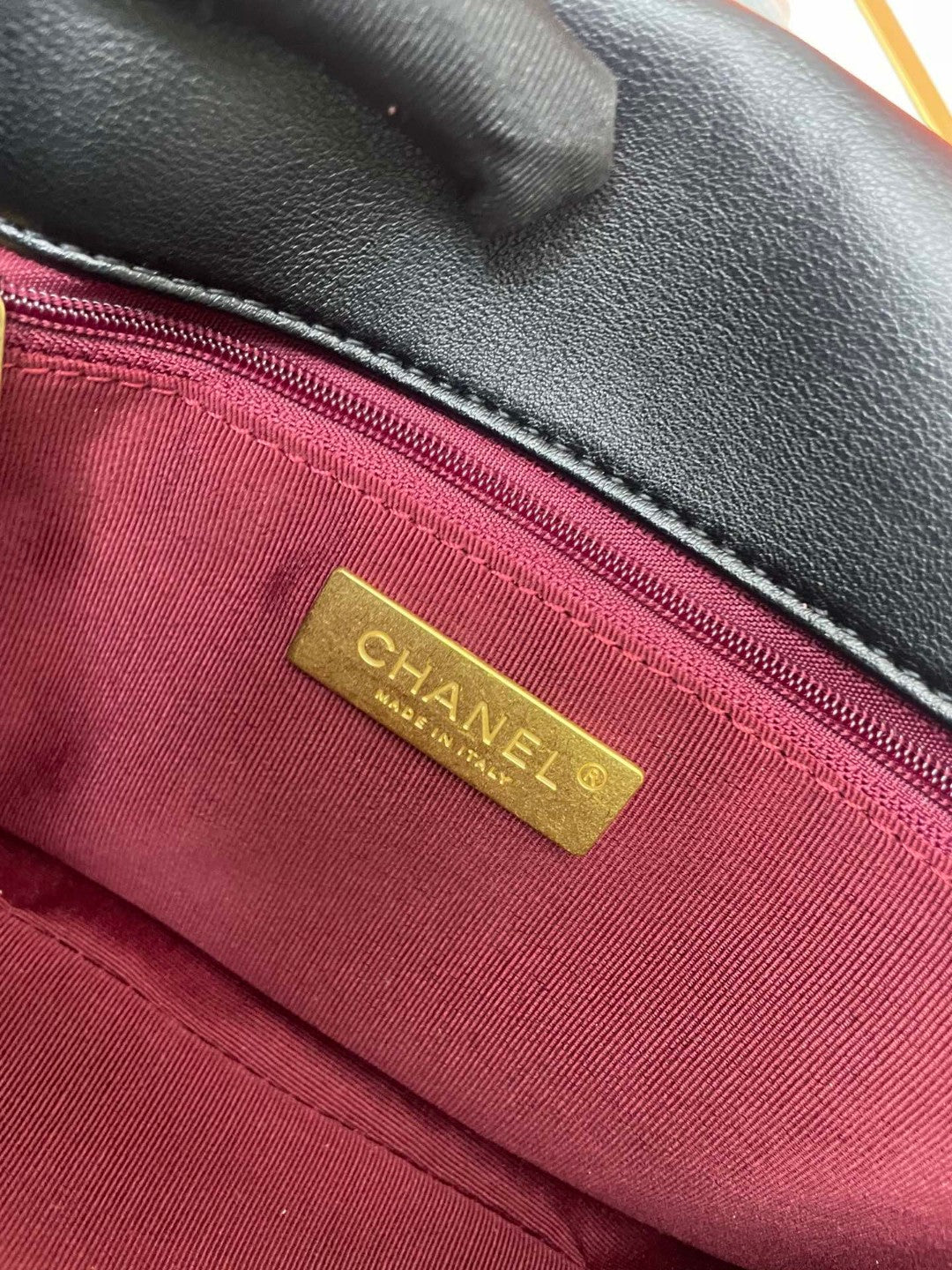 black Chanel 19 flap bag in lambskin with gold-tone