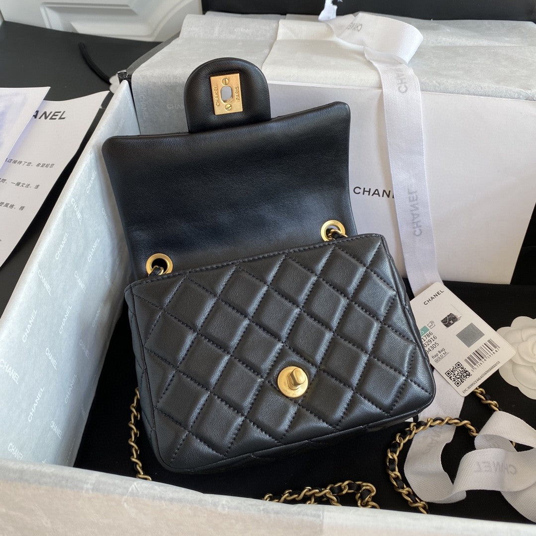 black quilted leather Chanel Mini Flap Bag with a gold-tone chain strap