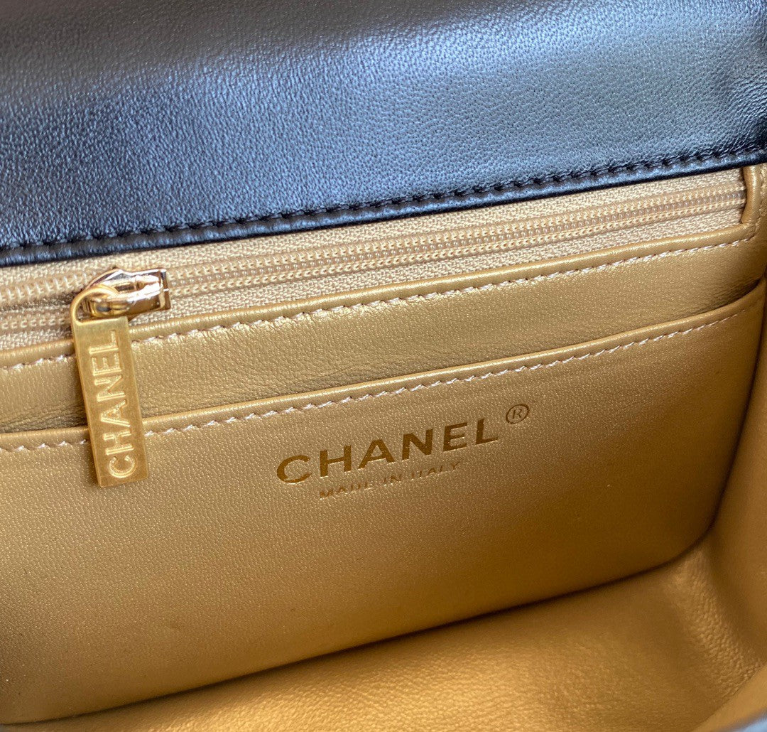 black quilted leather Chanel Mini Flap Bag with a gold-tone chain strap