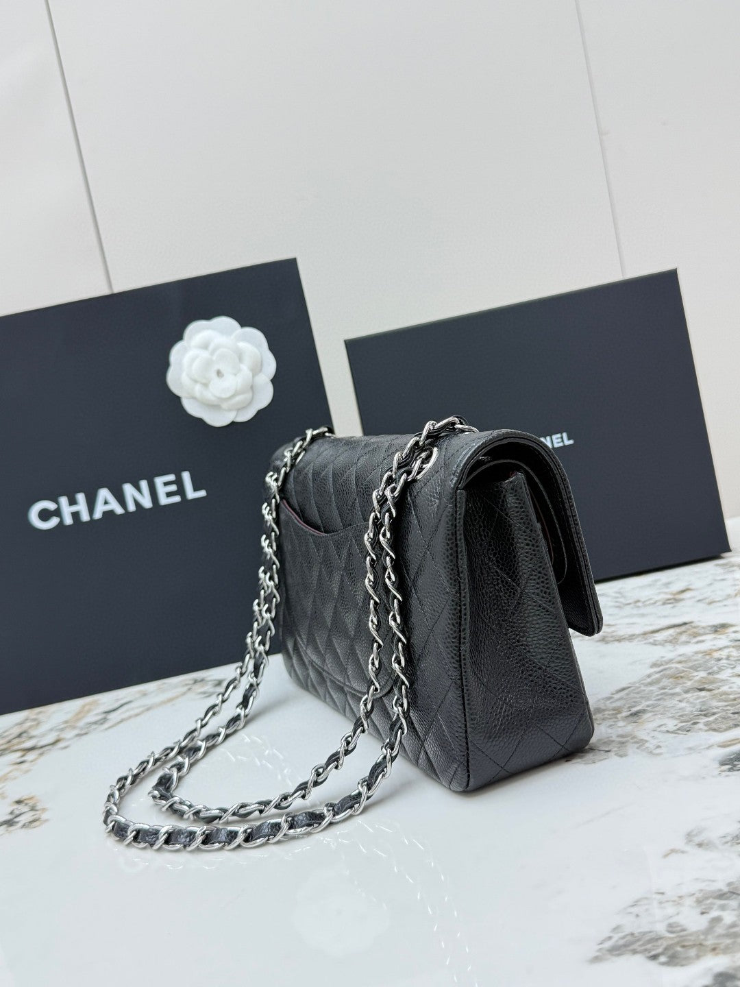 Chanel Classic Double Flap Medium bag in black caviar leather with silver-tone hardware