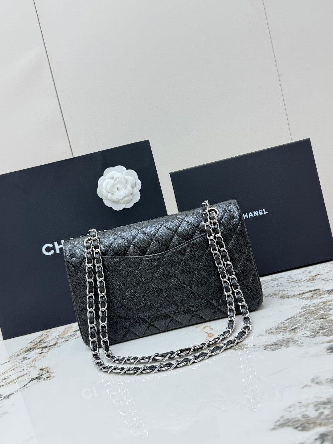 Chanel Classic Double Flap Medium bag in black caviar leather with silver-tone hardware