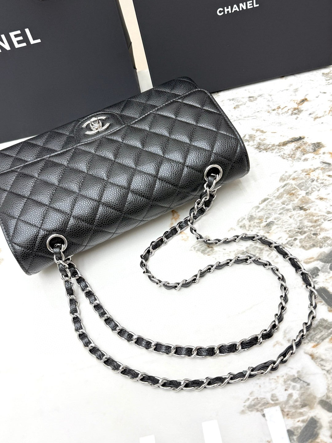 Chanel Classic Double Flap Medium bag in black caviar leather with silver-tone hardware