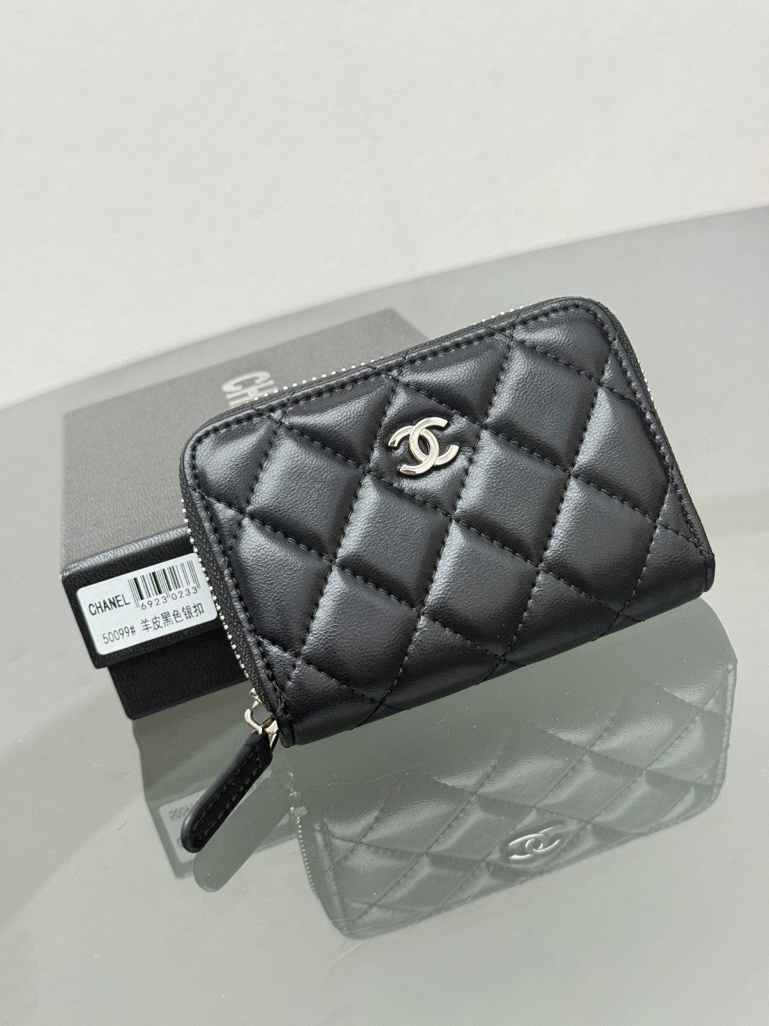 Chanel Classic Zipped Coin Purse in black quilted caviar leather with gold-tone hardware