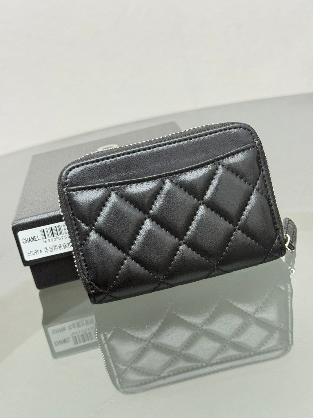 Chanel Classic Zipped Coin Purse in black quilted caviar leather with gold-tone hardware