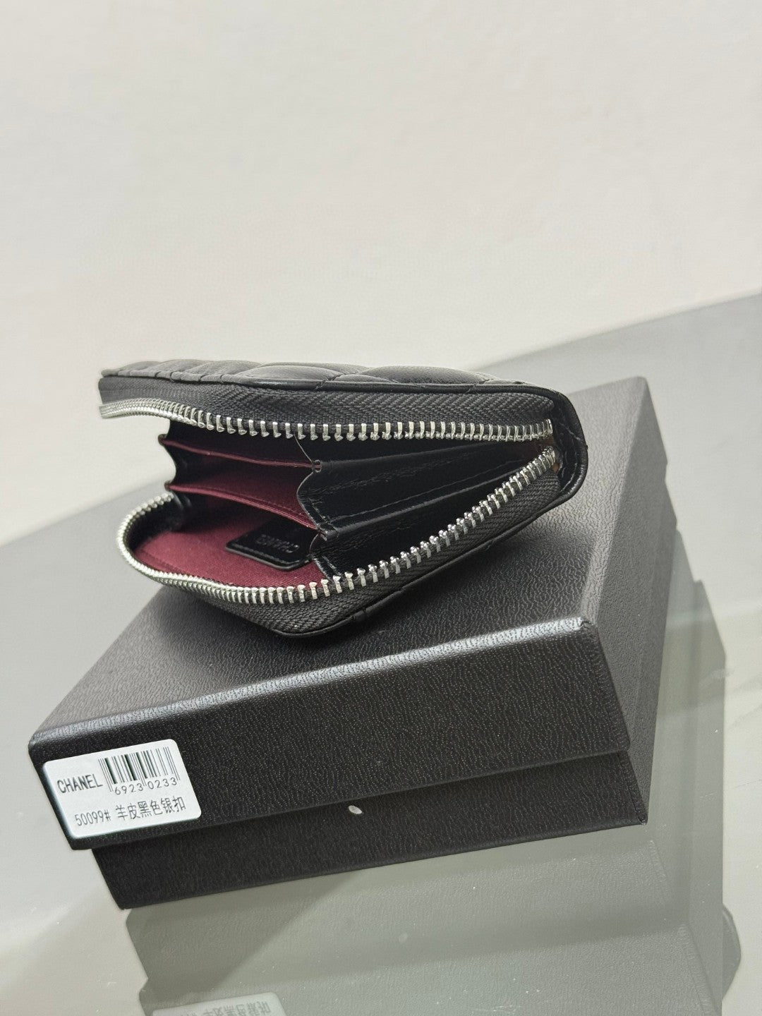 Chanel Classic Zipped Coin Purse in black quilted caviar leather with gold-tone hardware