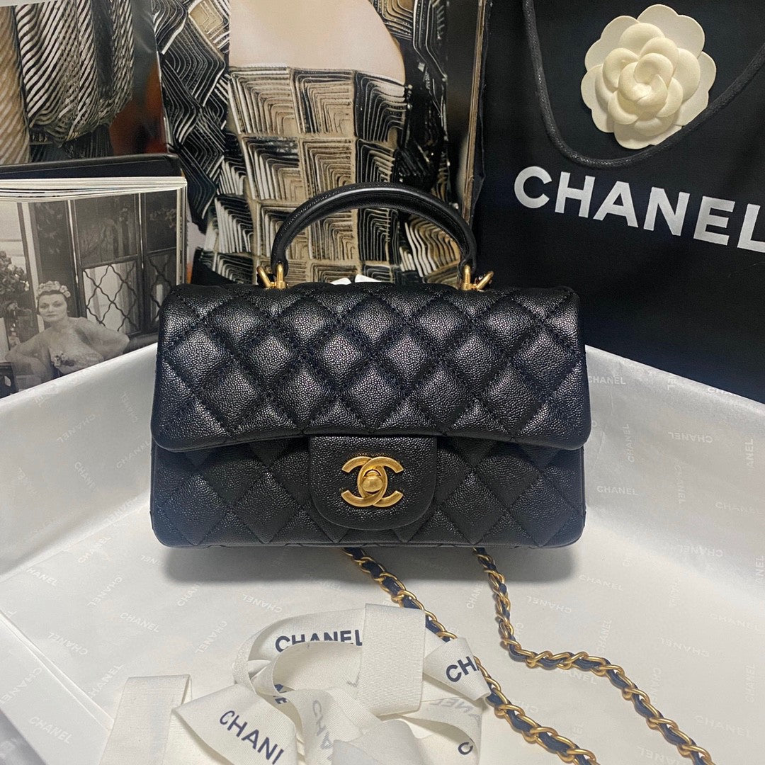 Chanel Classic Mini Rectangular Flap bag in black quilted caviar leather with light gold hardware