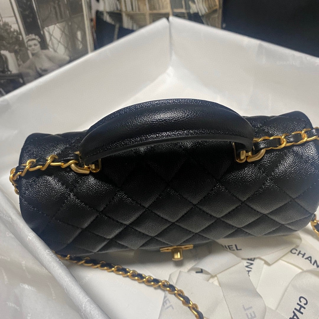 Chanel Classic Mini Rectangular Flap bag in black quilted caviar leather with light gold hardware