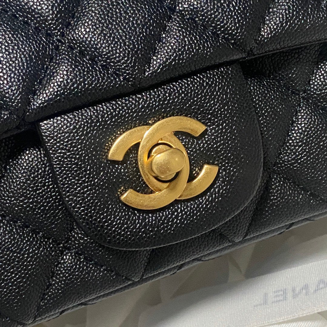 Chanel Classic Mini Rectangular Flap bag in black quilted caviar leather with light gold hardware