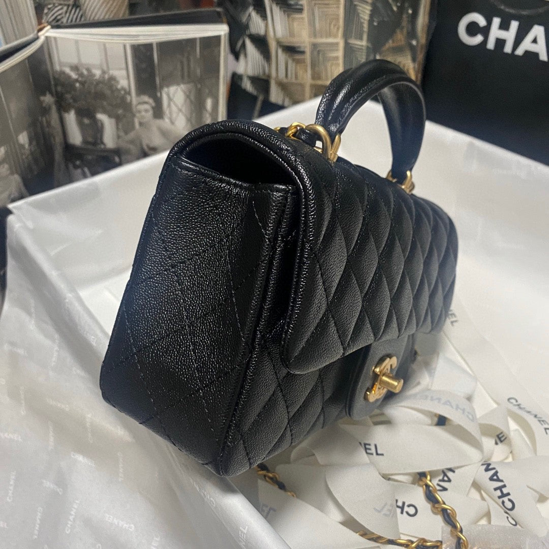 Chanel Classic Mini Rectangular Flap bag in black quilted caviar leather with light gold hardware