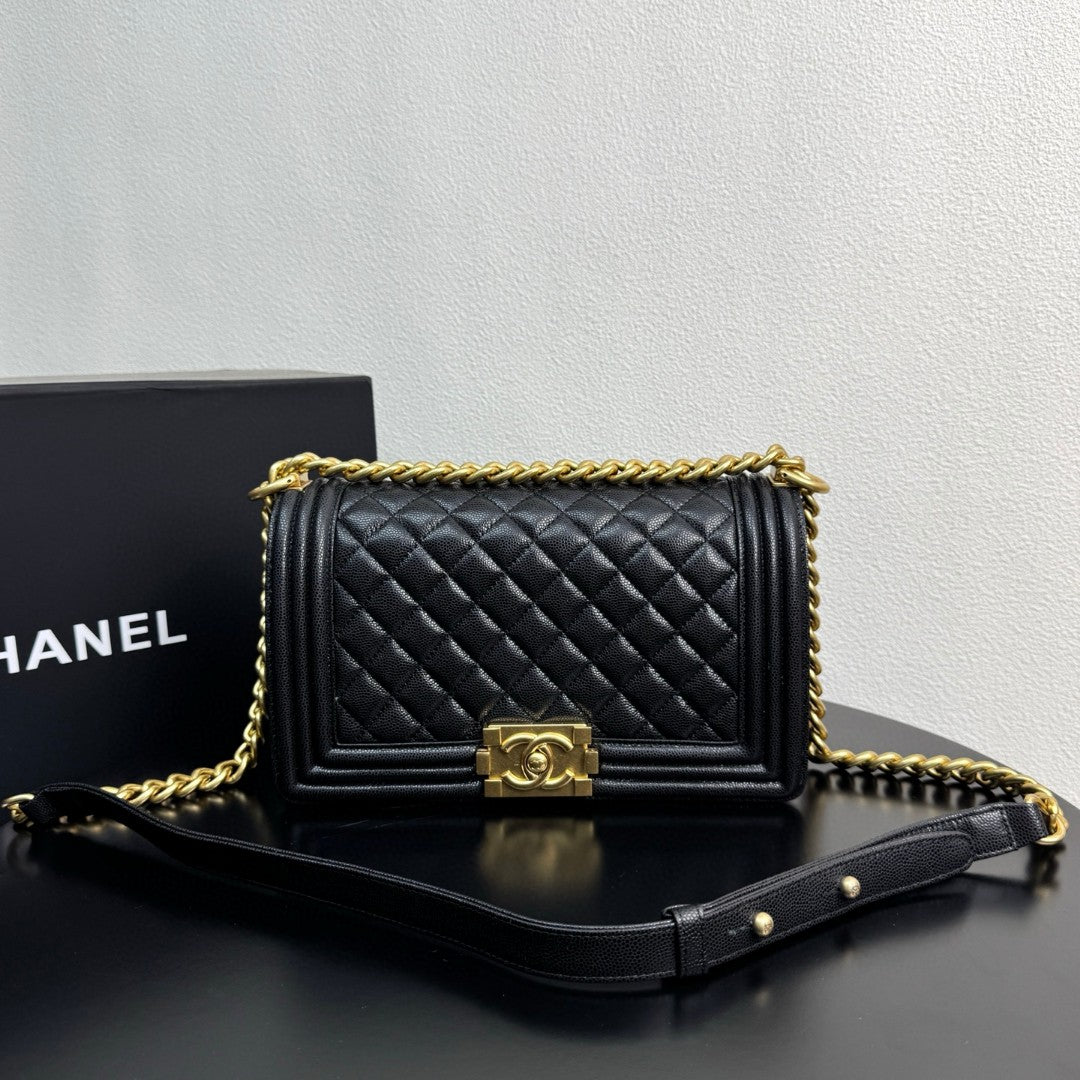 Chanel Medium Boy Flap bag in black caviar leather with gold-tone hardware
