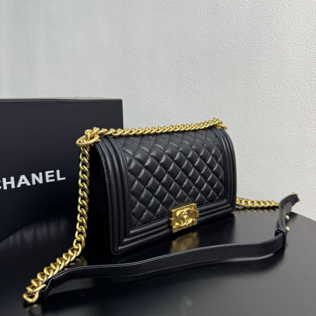 Chanel Medium Boy Flap bag in black caviar leather with gold-tone hardware