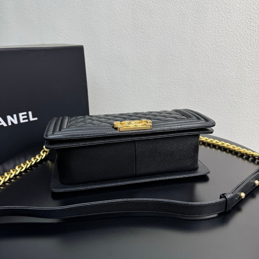 Chanel Medium Boy Flap bag in black caviar leather with gold-tone hardware