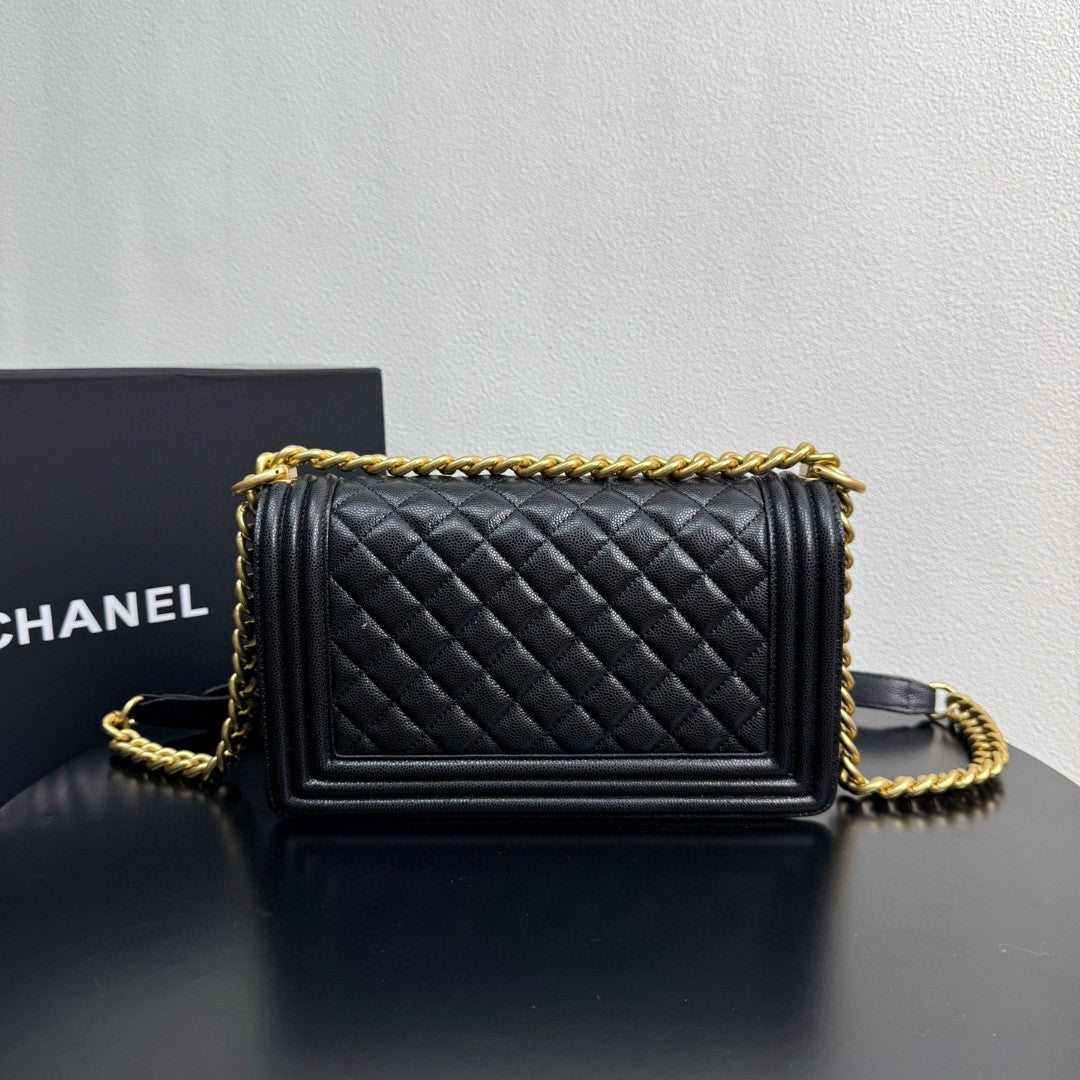 Chanel Medium Boy Flap bag in black caviar leather with gold-tone hardware
