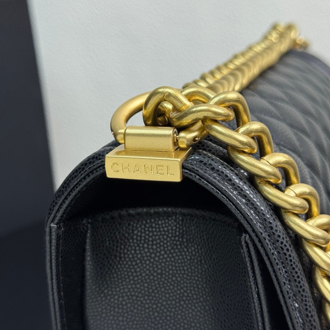 Chanel Medium Boy Flap bag in black caviar leather with gold-tone hardware