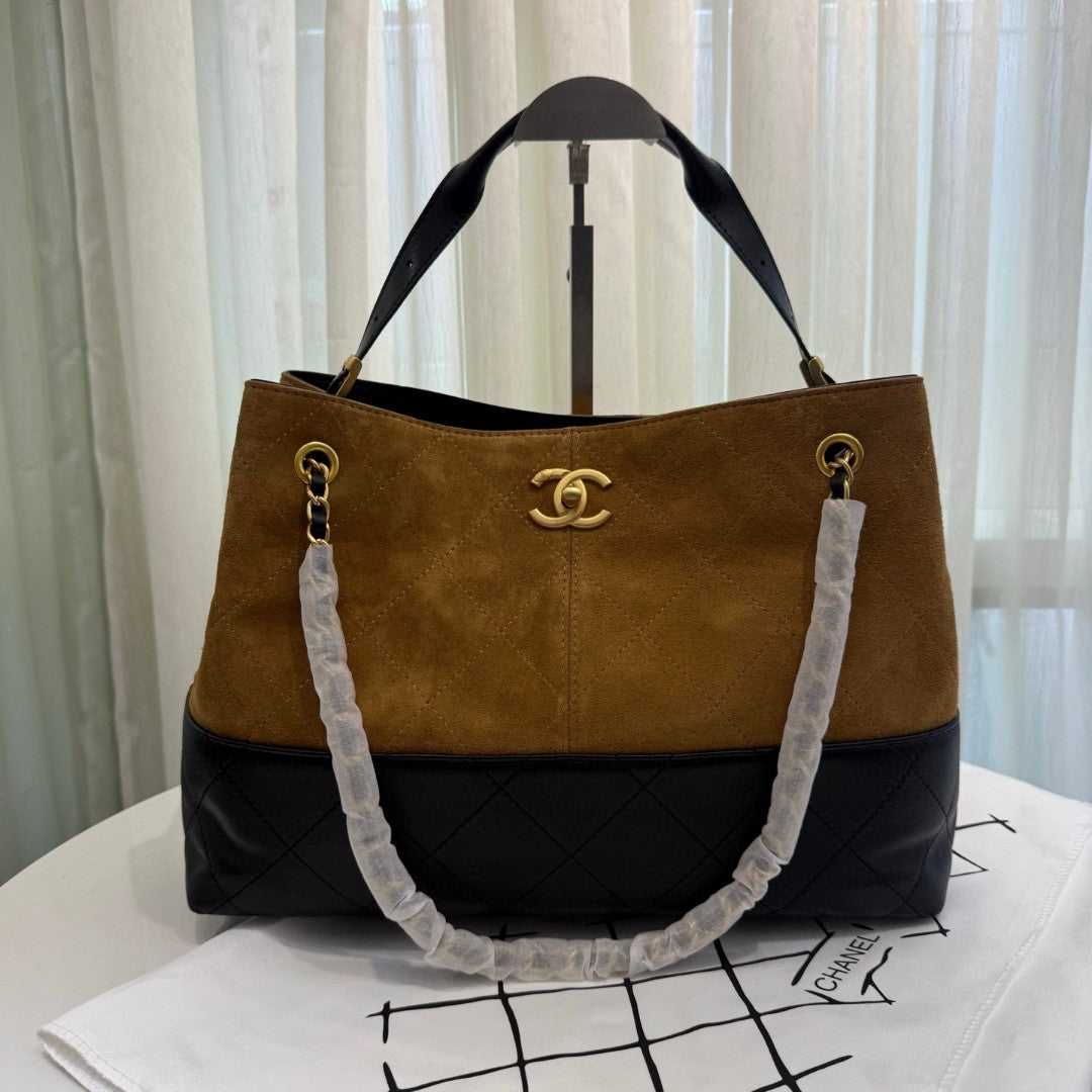 Chanel 25A Two-Tone Shopping Bag in beige suede, black calfskin, and gold-tone metal hardware