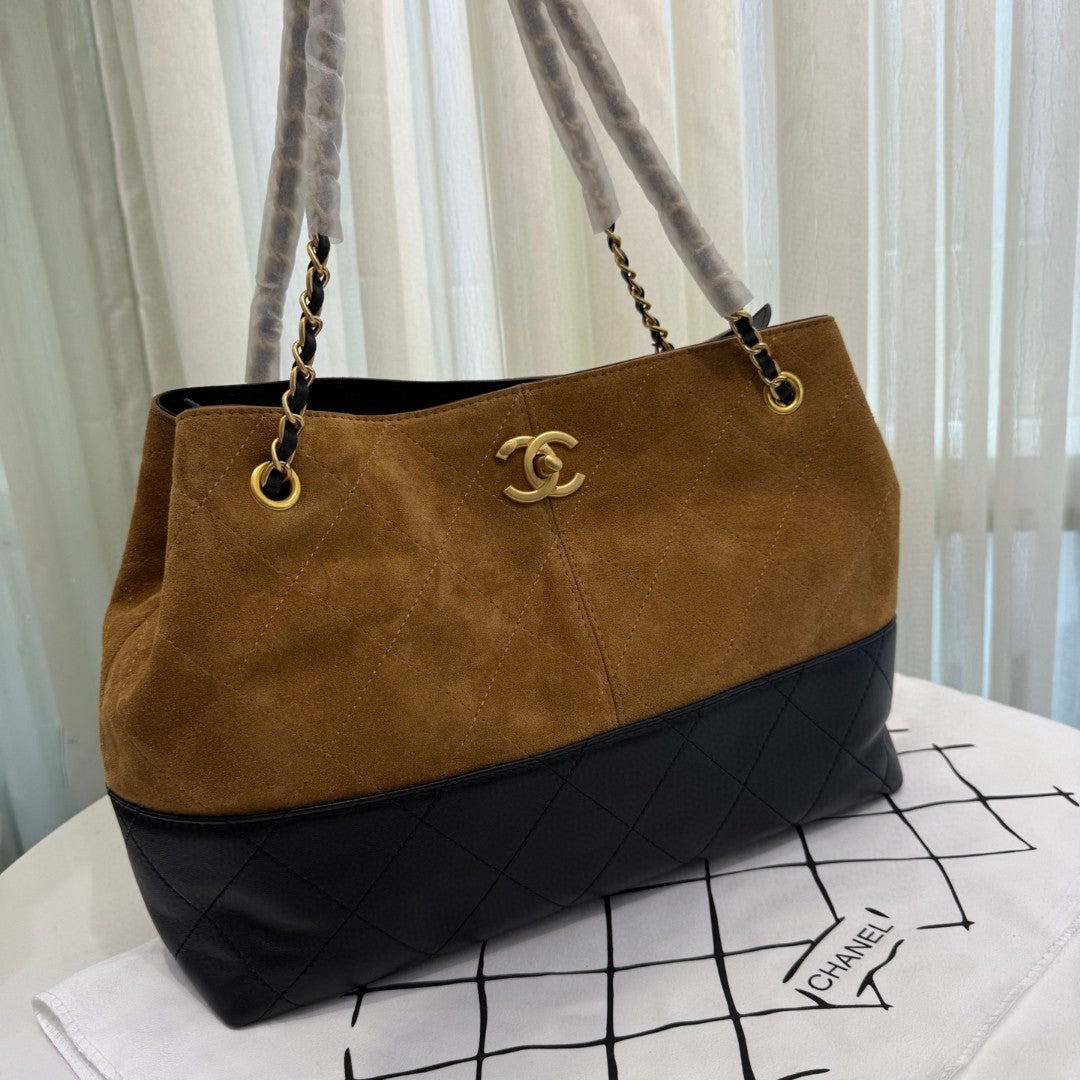 Chanel 25A Two-Tone Shopping Bag in beige suede, black calfskin, and gold-tone metal hardware