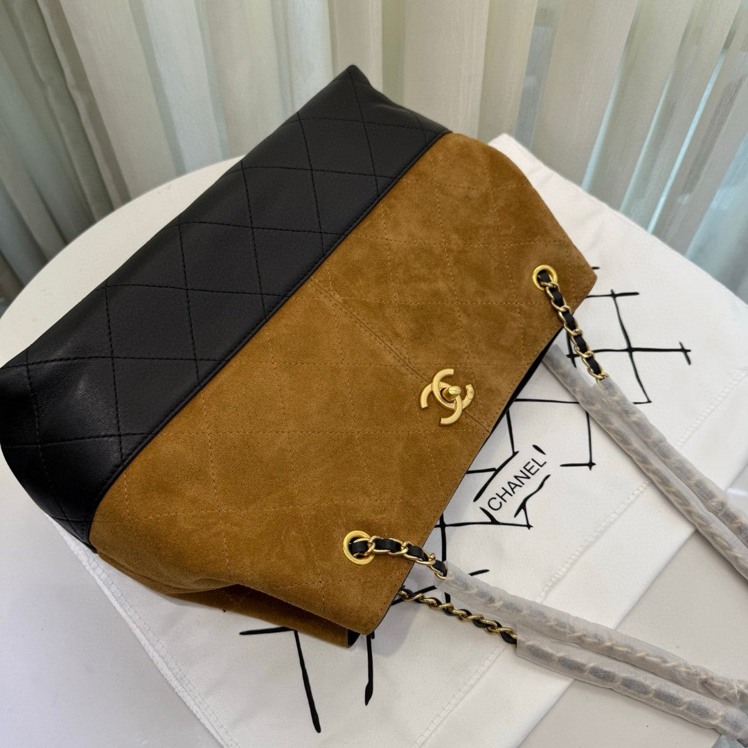 Chanel 25A Two-Tone Shopping Bag in beige suede, black calfskin, and gold-tone metal hardware