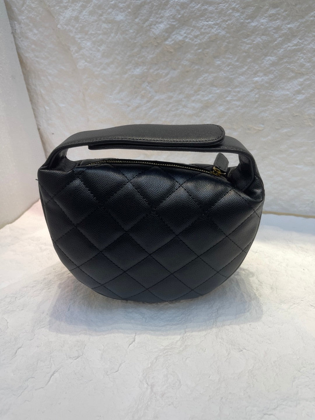 Chanel Spring-Summer 2025 (25S) pouch in black grained calfskin leather with imitation pearl and gold-tone metal hardware