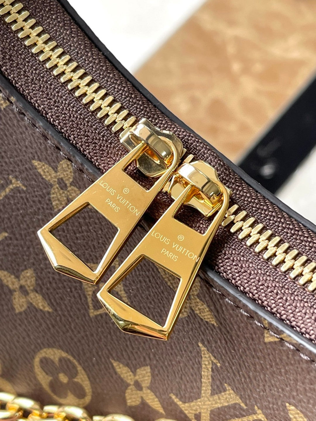 Louis Vuitton Boulogne PM bag in classic Monogram canvas with natural cowhide leather trim and gold-color hardware