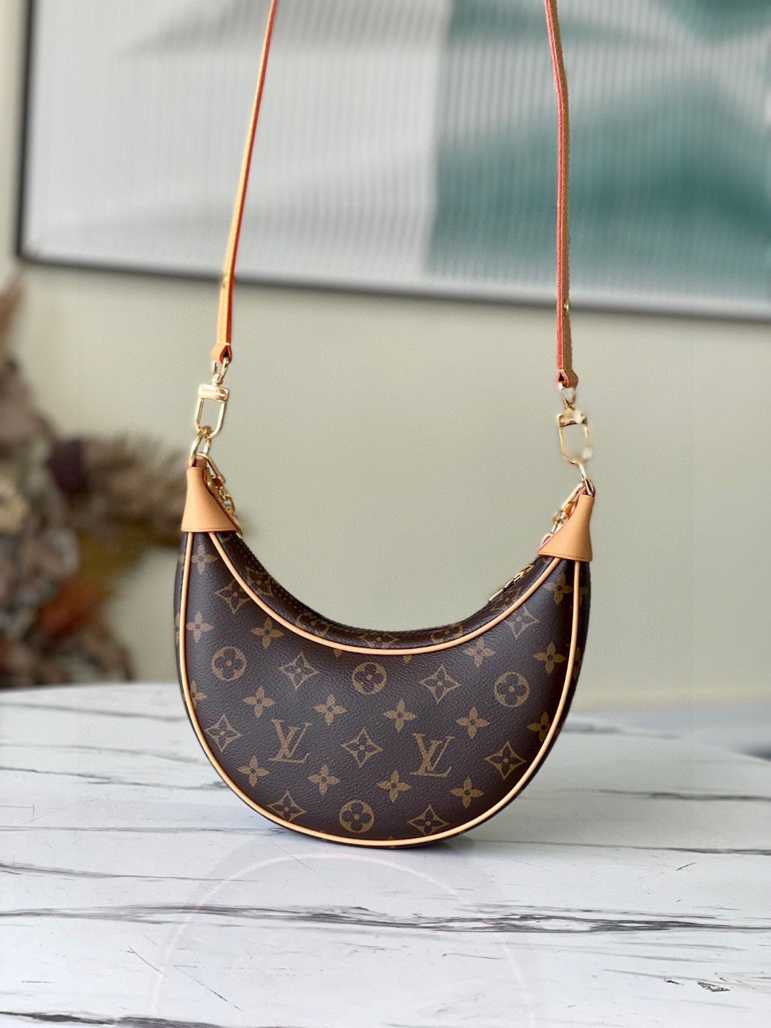 Louis Vuitton Loop handbag in Monogram brown coated canvas with natural cowhide leather trim and gold-tone hardware