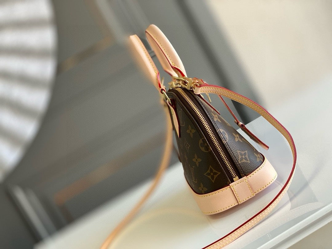 Louis Vuitton Alma BB handbag in Monogram canvas