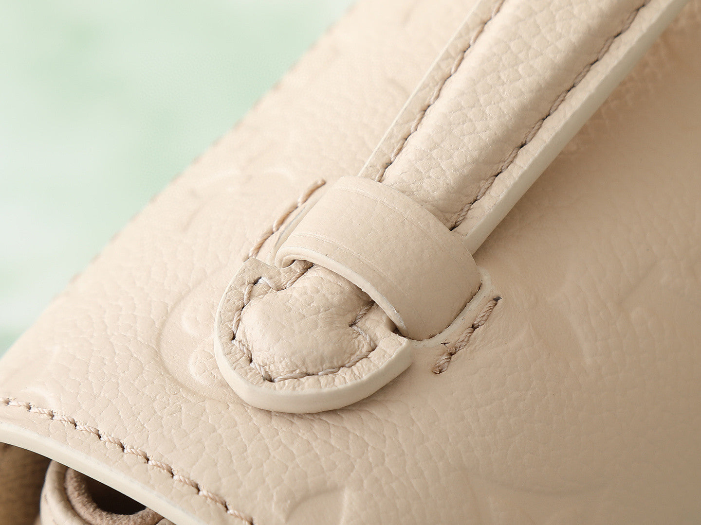 Louis Vuitton Pochette Métis East West handbag in embossed Monogram Empreinte leather