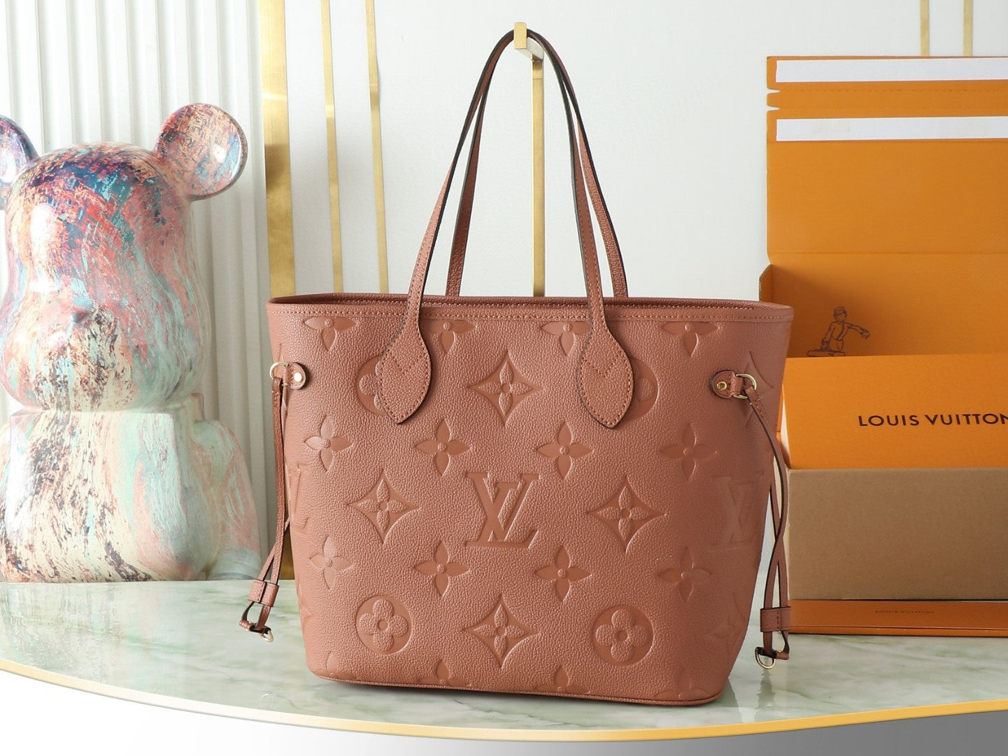 Louis Vuitton Neverfull MM tote bag in the Cognac brown Monogram Empreinte leather