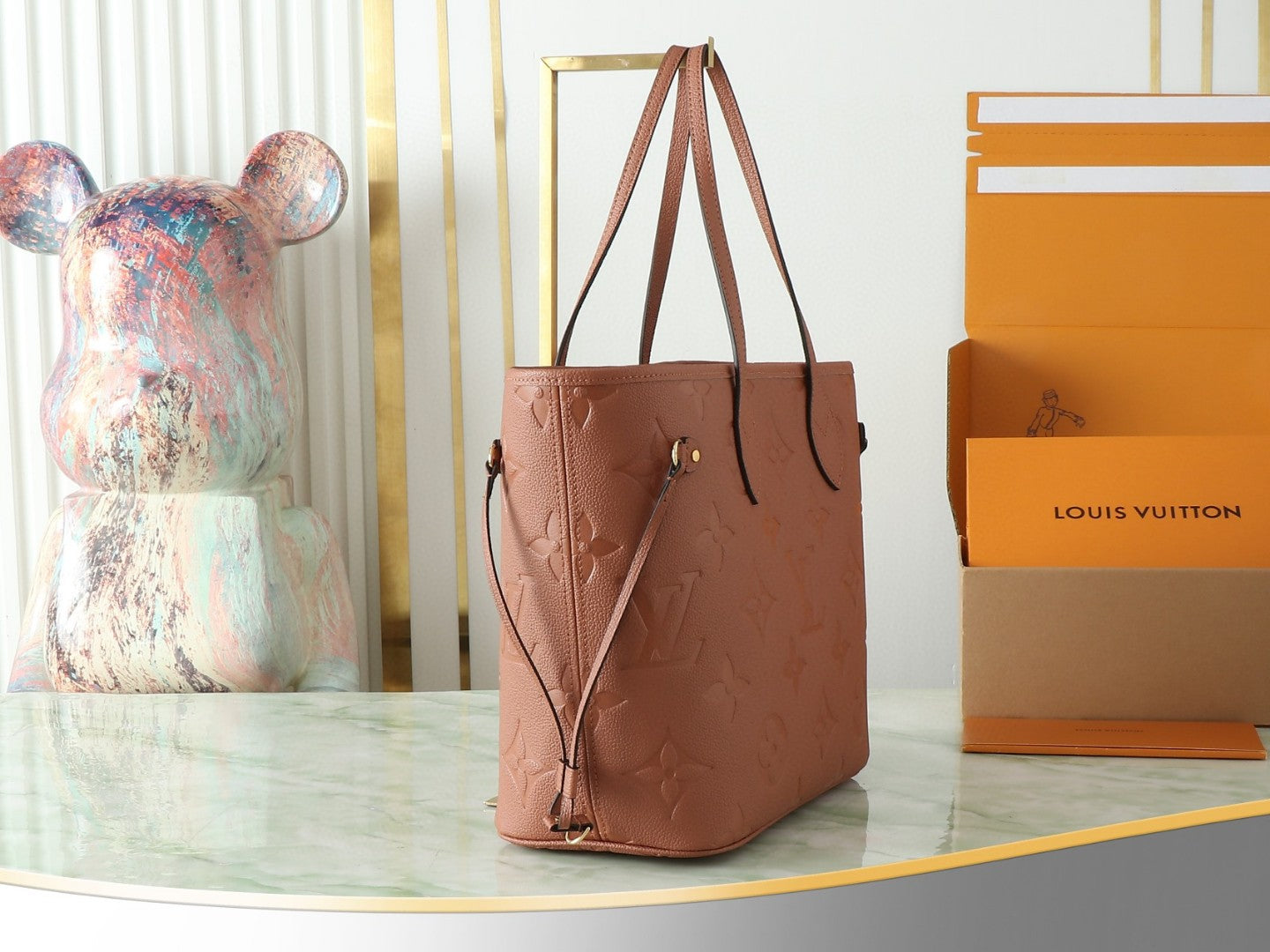 Louis Vuitton Neverfull MM tote bag in the Cognac brown Monogram Empreinte leather