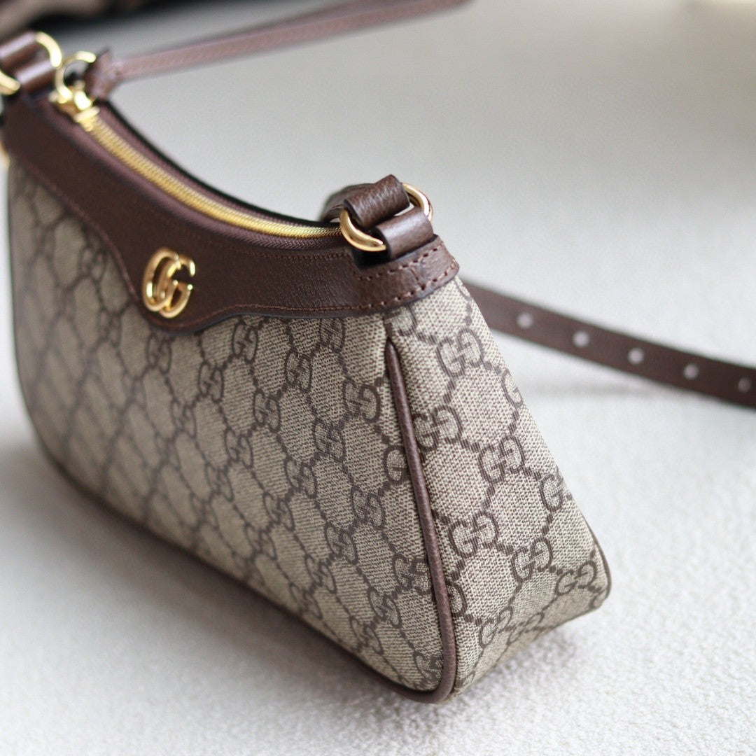 Gucci Ophidia mini bag in beige and ebony GG Supreme canvas with brown leather trim and a gold-toned Double G logo