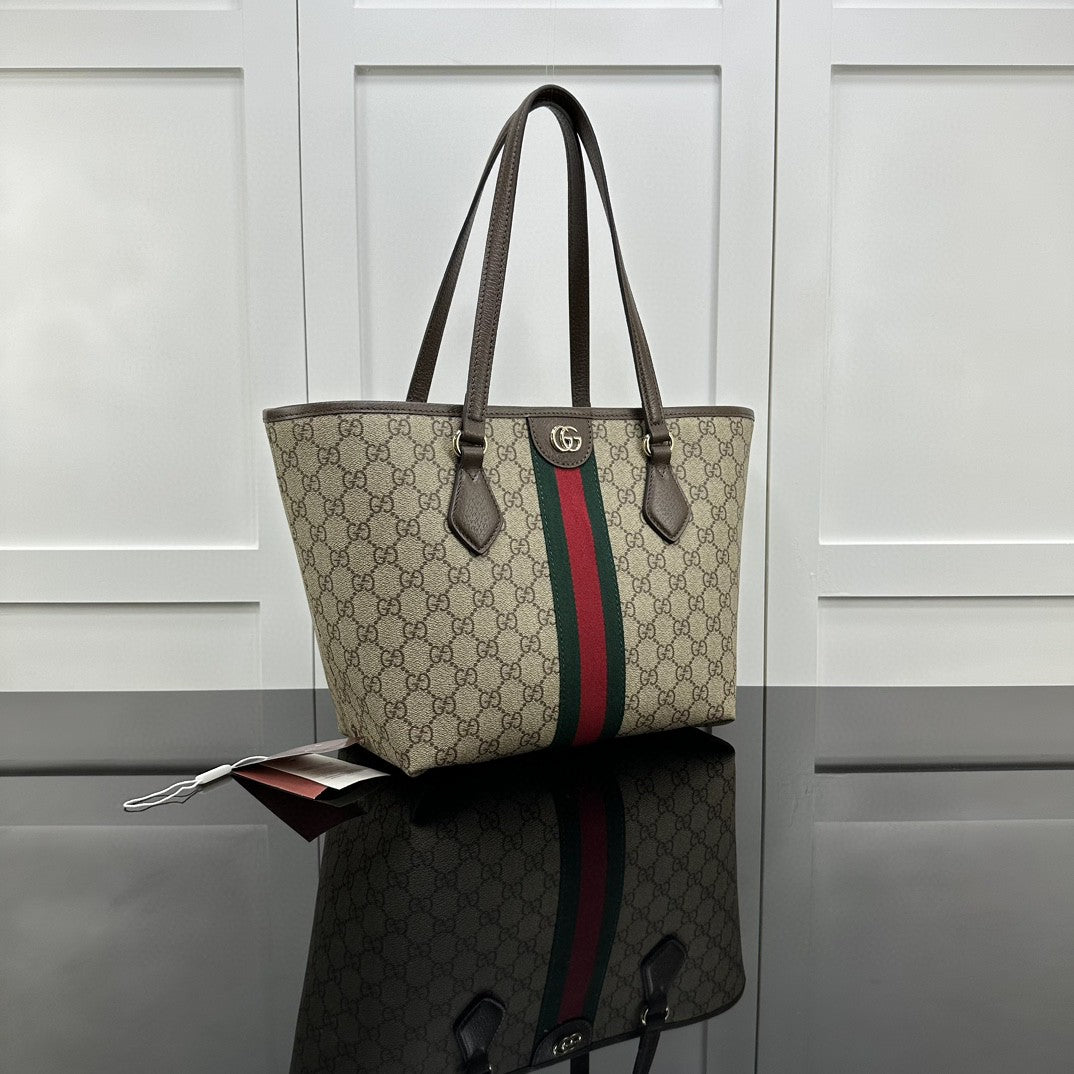 Gucci Ophidia GG medium tote bag crafted from GG Supreme canvas with brown leather trim and the signature green and red Web stripe