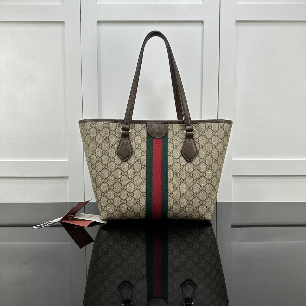 Gucci Ophidia GG medium tote bag crafted from GG Supreme canvas with brown leather trim and the signature green and red Web stripe