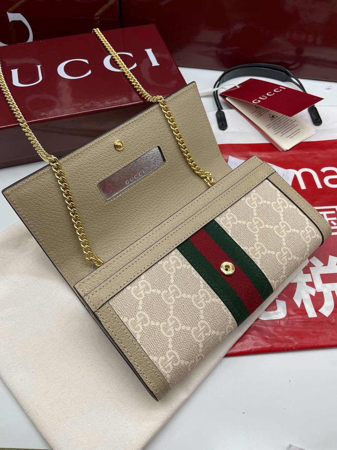 Gucci Ophidia chain wallet in beige/ebony GG Supreme canvas with brown leather trim and a green and red Web stripe