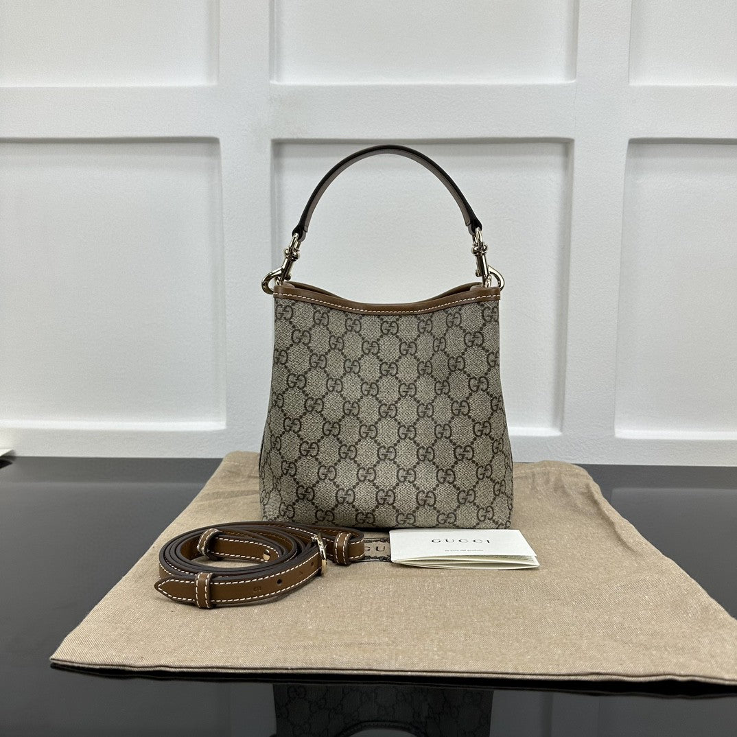 Gucci GG Emblem Small bucket bag in beige and ebony coated canvas with brown leather trim